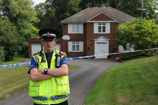 Police outside the Challen family home in August 2010